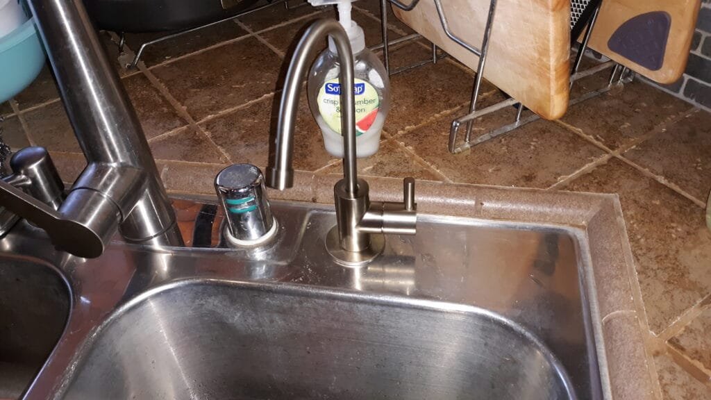 Dedicated reverse osmosis drinking water faucet at kitchen sink