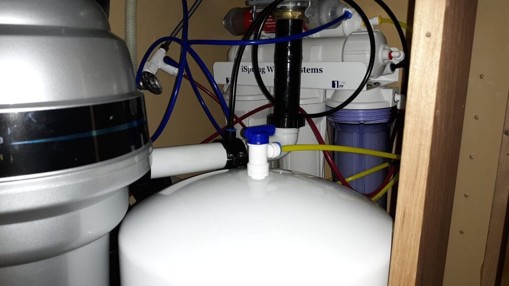 Reverse osmosis storage tank and tubing under kitchen sink
