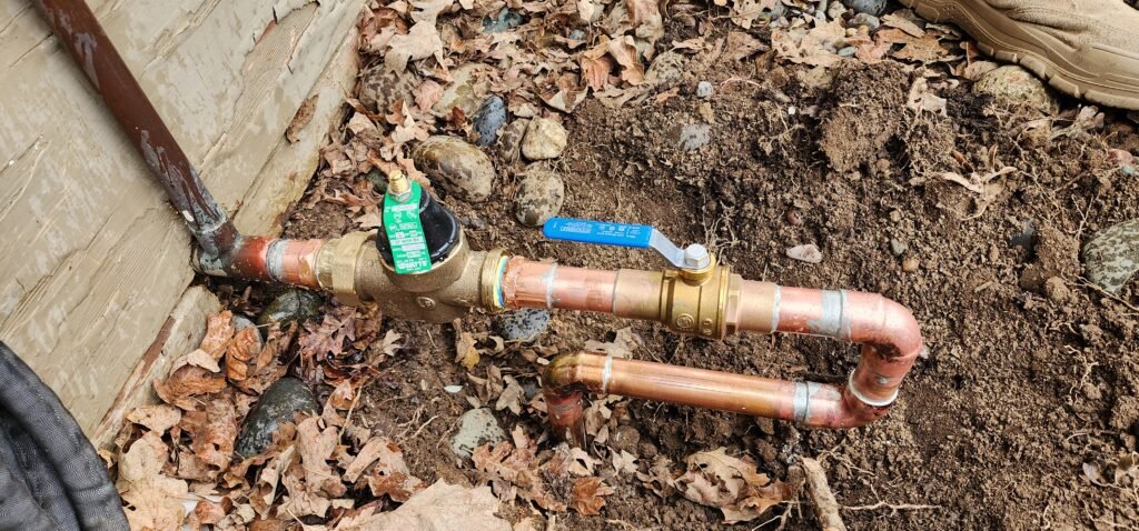 New pressure reducing valve installed on copper pipe
