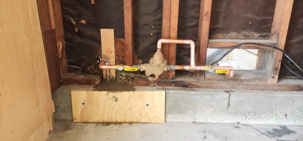 Pressure reducing valve installed near residential main water line