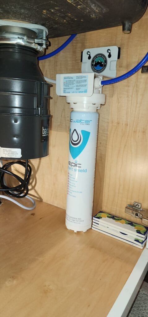 Under-sink water filter cartridge installation