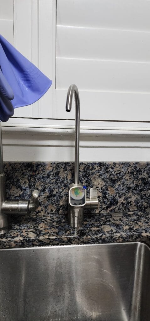 Reverse osmosis drinking water faucet at kitchen sink